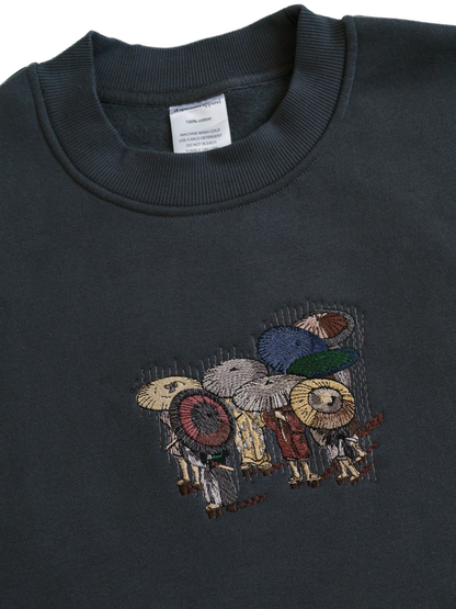 TRAVELERS IN THE RAIN SWEATSHIRT